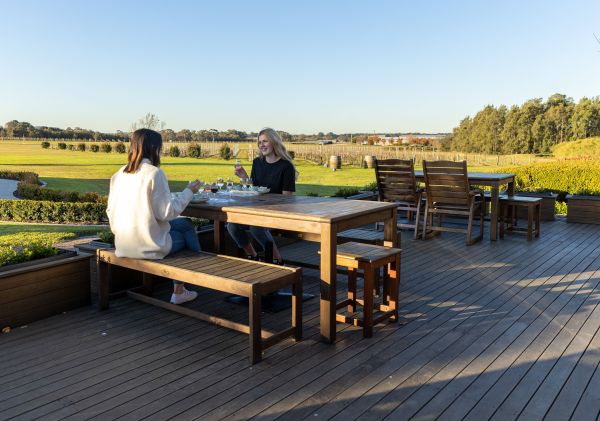 Peterson House, Pokolbin Friends enjoying wine outdoors at Peterson House, Pokolbin