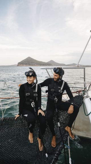 Couple enjoying a day out on the water with Dolphin Swim Australia in Port Stephens, North Coast